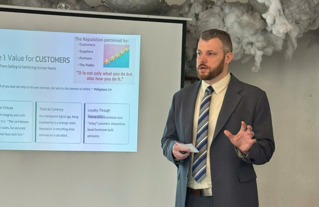 Josh presenting on value and financial stewardship for construction businesses